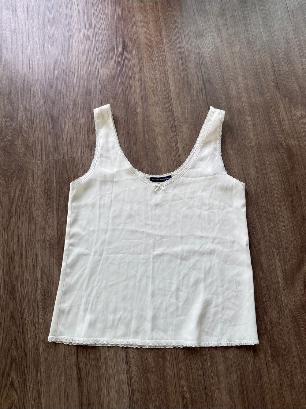 White silk cami with lace trim from Brandy Melville